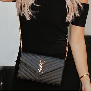 YSL envelope crossbody black and gold in size large